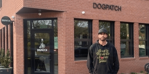 Business owner Jay Downton stands outside one of his businesses, Dogpatch Bistro Pub, in the Umphreville Block in Riverdale, Edmonton, Alberta.